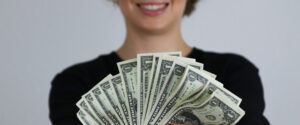 Donor with dollar bills