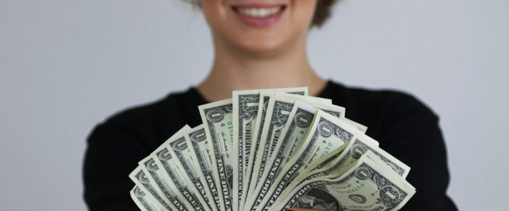 Donor with dollar bills