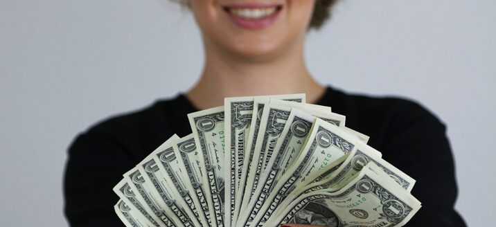 Donor with dollar bills